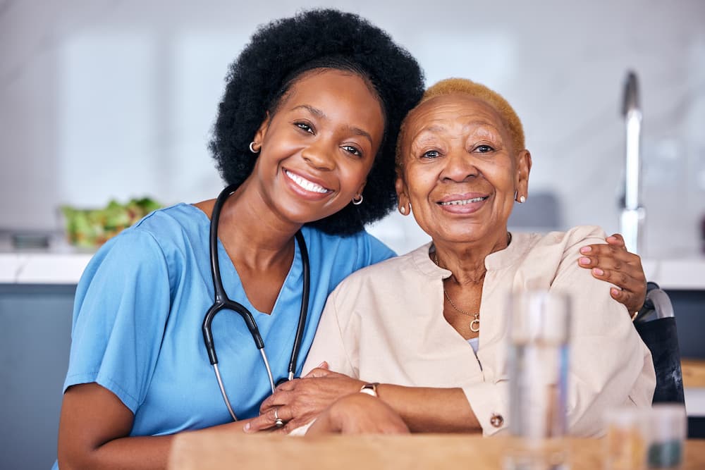 senior resident of assisted living posing with caretaker